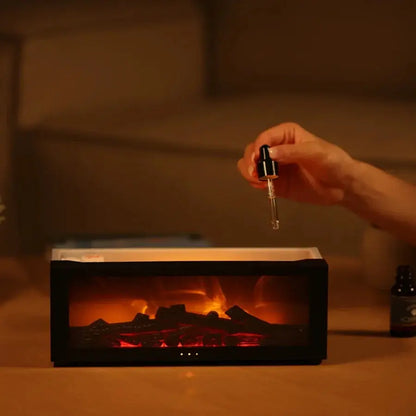 Aromatherapy oil being added to fireplace humidifier