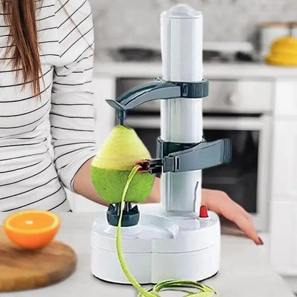 White electric rotating peeler in use, peeling a green fruit. Sleek design with adjustable arms, ideal for fruits and vegetables.