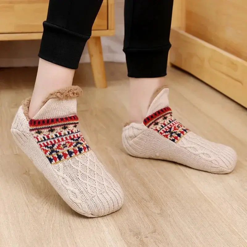 Beige fuzzy slipper socks with colorful pattern worn