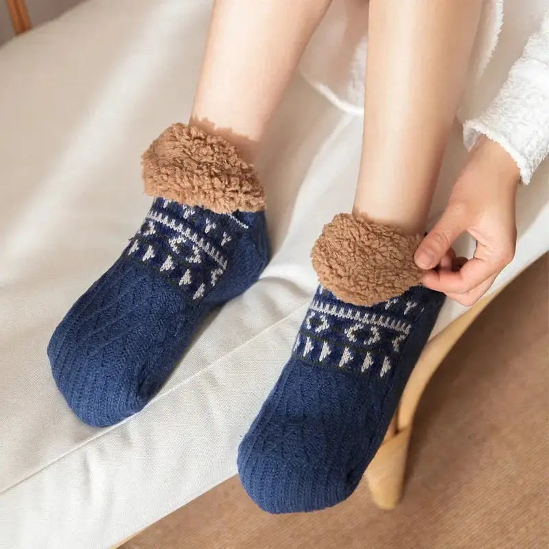 Blue fuzzy slipper socks being worn for cozy fit