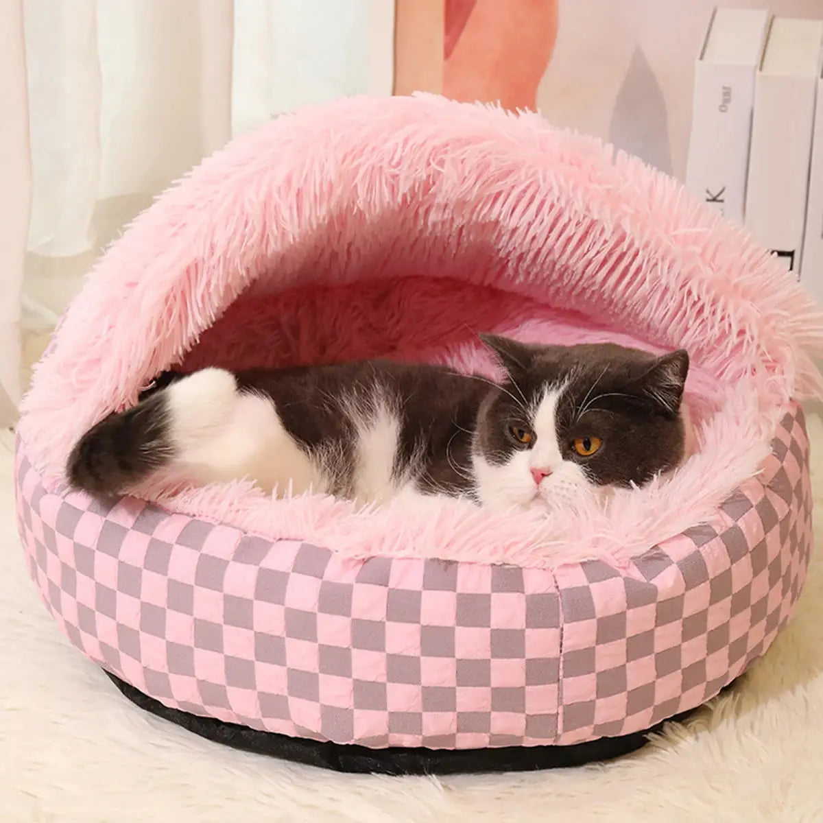 Pink Winter Warm Pet Nest with a cozy plush interior, featuring a cat comfortably resting inside.