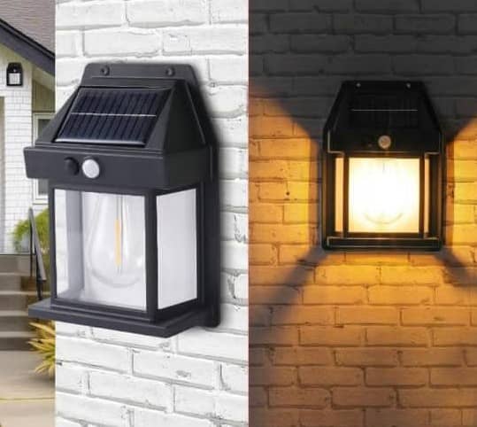 Outdoor solar light illuminating a brick wall at night.