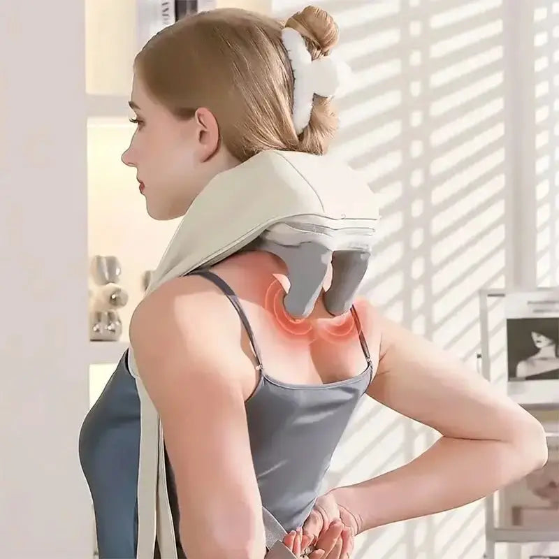 Woman using a back massager with heat and remote, targeting upper back muscles for pain relief and relaxation. Ideal for personal care and massage therapy.